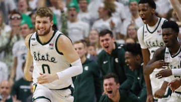 EAST LANSING, MICHIGAN - JANUARY 05: Kyle Ahrens #0 of the Michigan State Spartans reacts with teammates after a three point basket against the Michigan Wolverines during the second half at the Breslin Center on January 05, 2020 in East Lansing, Michigan. Michigan State won the game 87-69. (Photo by Gregory Shamus/Getty Images)