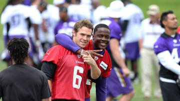 Jun 15, 2016; Minneapolis, MN, USA; Minnesota Vikings quarterback Teddy Bridgewater (5) and quarterback Taylor Heinicke (6) react after practice during mini camp. Mandatory Credit: Brad Rempel-USA TODAY Sports