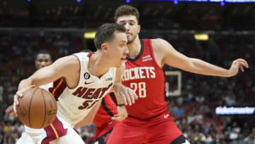 Duncan Robinson #55 of the Miami Heat drives to the basket while being defended by Alperen Sengun #28 of the Houston Rockets(Photo by Eric Espada/Getty Images)