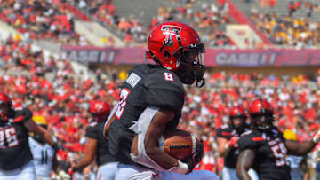 LUBBOCK, TX - SEPTEMBER 29: De'Quan Bowman #8 of the Texas Tech Red Raiders catches a touchdown pass during the second half of the game against the West Virginia Mountaineers on September 29, 2018 at Jones AT&T Stadium in Lubbock, Texas. West Virginia defeated Texas Tech 42-34. (Photo by John Weast/Getty Images)