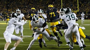 Oct 17, 2015; Ann Arbor, MI, USA; Michigan State Spartans defensive back Jalen Watts-Jackson (20) dives into the end zone for a game winning touchdown as the clock runs out in the fourth quarter against the Michigan Wolverines at Michigan Stadium. Michigan State 27-23. Mandatory Credit: Rick Osentoski-USA TODAY Sports