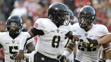 NORMAN, OK - SEPTEMBER 22: Quarterback Kelvin Hopkins Jr. #8 of the Army Black Knights celebrates a touchdown against the Oklahoma Sooners at Gaylord Family Oklahoma Memorial Stadium on September 22, 2018 in Norman, Oklahoma. The Sooners defeated the Black Knights 28-21 in overtime. (Photo by Brett Deering/Getty Images)