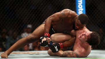 DALLAS, TX - SEPTEMBER 08: Tyron Woodley, top and Darren Till in their UFC Welterweight Title bout during UFC 228 at American Airlines Center on September 8, 2018 in Dallas, United States. (Photo by Ronald Martinez/Getty Images)