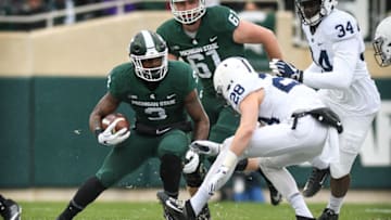EAST LANSING, MI - NOVEMBER 04: Michigan State Spartans running back L.J. Scott (3) looks for running room during a Big Ten conference college football game between Michigan State and Penn State on November 4, 2017, at Spartan Stadium in East Lansing, MI.(Photo by Adam Ruff/Icon Sportswire via Getty Images)