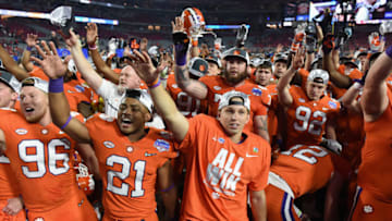 GLENDALE, AZ - DECEMBER 31: Clemson Tigers players celebrate after defeating the Ohio State Buckeyes 31-0 to win the 2016 PlayStation Fiesta Bowl at University of Phoenix Stadium on December 31, 2016 in Glendale, Arizona. (Photo by Norm Hall/Getty Images)