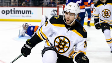 NEW YORK, NEW YORK - JANUARY 11: Jake DeBrusk #74 of the Boston Bruins celebrates his second period goal against the New York Islanders at Barclays Center on January 11, 2020 in New York City. (Photo by Mike Stobe/NHLI via Getty Images)