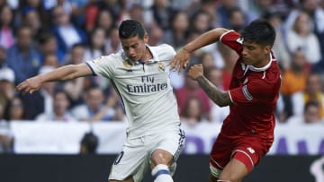 MADRID, SPAIN - MAY 14: James Rodriguez (L) of Real Madrid competes for the ball with Joaquin Correa of Sevilla during the La Liga match between Real Madrid CF and Sevilla CF at Estadio Santiago Bernabeu on May 14, 2017 in Madrid, Spain. (Photo by fotopress/Getty Images )