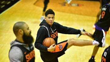 PHOENIX, AZ - OCTOBER 2: Devin Booker #1 of the Phoenix Suns looks on during the Phoenix Suns NBA all access practice on October 2, 2018, at Talking Stick Resort Arena in Phoenix, Arizona. NOTE TO USER: User expressly acknowledges and agrees that, by downloading and or using this Photograph, user is consenting to the terms and conditions of the Getty Images License Agreement. Mandatory Copyright Notice: Copyright 2018 NBAE (Photo by Barry Gossage/NBAE via Getty Images)