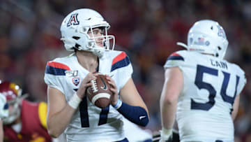 October 19, 2019; Los Angeles, CA, USA; Arizona Wildcats quarterback Grant Gunnell (17) drops back to pass against the Southern California Trojans during the second half at the Los Angeles Memorial Coliseum. Mandatory Credit: Gary A. Vasquez-USA TODAY Sports