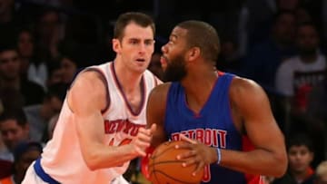 Jan 2, 2015; New York, NY, USA; New York Knicks center Jason Smith (14) defends Detroit Pistons forward Greg Monroe (10) during the third quarter at Madison Square Garden. Detroit Pistons won 97-81. Mandatory Credit: Anthony Gruppuso-USA TODAY Sports