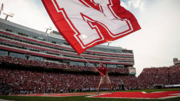 LINCOLN, NE - SEPTEMBER 5: The Nebraska Cornhuskers cheer squad waves a giant flag after a touchdown during their game against the Brigham Young Cougars at Memorial Stadium on September 5, 2015 in Lincoln, Nebraska. (Photo by Eric Francis/Getty Images)