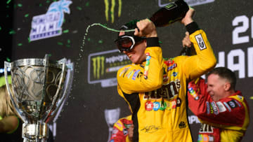 HOMESTEAD, FLORIDA - NOVEMBER 17: Kyle Busch, driver of the #18 M&M's Toyota, celebrates in Victory Lane after winning the Monster Energy NASCAR Cup Series Ford EcoBoost 400 and the Monster Energy NASCAR Cup Series Championship at Homestead Speedway on November 17, 2019 in Homestead, Florida. (Photo by Jared C. Tilton/Getty Images)