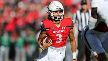 Cincinnati Bearcats quarterback Evan Prater runs with ball against the South Florida Bulls at Nippert Stadium. USA Today.