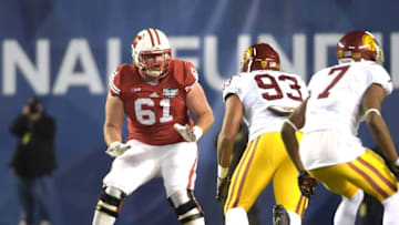 Dec 30, 2015; San Diego, CA, USA; Wisconsin Badgers offensive lineman Tyler Marz (61) defends against Southern California Trojans defensive end Greg Townsend Jr. (93) during the 2015 Holiday Bowl at Qualcomm Stadium. Mandatory Credit: Kirby Lee-USA TODAY Sports