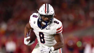 LOS ANGELES, CALIFORNIA - OCTOBER 07: DJ Williams #8 of the Arizona Wildcats runs the ball during the first quarter against the USC Trojans at United Airlines Field at the Los Angeles Memorial Coliseum on October 07, 2023 in Los Angeles, California. (Photo by Katelyn Mulcahy/Getty Images)