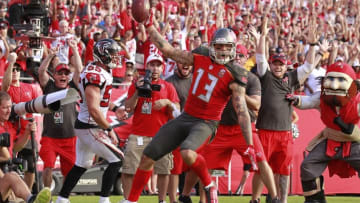 Dec 6, 2015; Tampa, FL, USA; Tampa Bay Buccaneers wide receiver Mike Evans (13) celebrates as he scores the game winning touchdown during the second half against the Atlanta Falcons at Raymond James Stadium. Tampa Bay defeated Atlanta 23-19. Mandatory Credit: Kim Klement-USA TODAY Sports