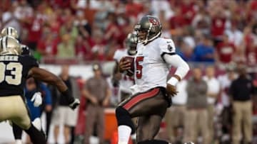 Sep 15, 2013; Tampa, FL, USA; Tampa Bay Buccaneers quarterback Josh Freeman (5) slides for a first down during the first half of the game against the New Orleans Saints at Raymond James Stadium. Mandatory Credit: Rob Foldy-USA TODAY Sports
