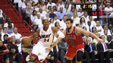 May 6, 2013; Miami, FL, USA; Miami Heat shooting guard Ray Allen (34) dribbles as Chicago Bulls shooting guard Marco Belinelli (8) defends during the second half in game one of the second round of the 2013 NBA Playoffs at American Airlines Arena. The Bulls won 93-86. Mandatory Credit: Steve Mitchell-USA TODAY Sports