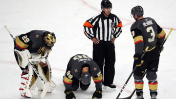 LAS VEGAS, NEVADA - OCTOBER 02: Nate Schmidt #88 of the Vegas Golden Knights is injured during the first period against the San Jose Sharks at T-Mobile Arena on October 02, 2019 in Las Vegas, Nevada. (Photo by Zak Krill/NHLI via Getty Images)