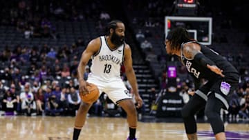 Feb 2, 2022; Sacramento, California, USA; Brooklyn Nets guard James Harden (13) dribbles the ball against Sacramento Kings center Richaun Holmes (22) during the first quarter at Golden 1 Center. Mandatory Credit: Sergio Estrada-USA TODAY Sports