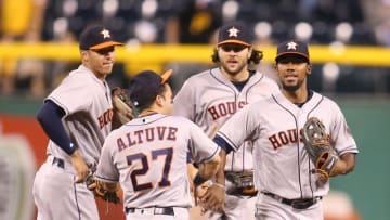 Aug 22, 2016; Pittsburgh, PA, USA; Houston Astros shortstop Carlos Correa (L) and second baseman Jose Altuve (27) and center fielder Jake Marisnick (RC) and left fielder Teoscar Hernandez (R) celebrate after defeating the Pittsburgh Pirates at PNC Park. The Astros won 3-1. Mandatory Credit: Charles LeClaire-USA TODAY Sports