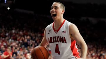 Mar 5, 2015; Tucson, AZ, USA; Arizona Wildcats guard T.J. McConnell (4) celebrates during the second half against the California Golden Bears at McKale Center. Arizona won 99-60. Mandatory Credit: Casey Sapio-USA TODAY Sports