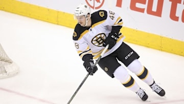 Nov 23, 2015; Toronto, Ontario, CAN; Boston Bruins defenseman Colin Miller (48) skates with the puck against the Toronto Maple Leafs at Air Canada Centre. The Bruins beat the Maple Leafs 4-3 in the shootout. Mandatory Credit: Tom Szczerbowski-USA TODAY Sports