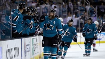 SAN JOSE, CA - JANUARY 13: Joe Thornton #19 of the San Jose Sharks is congratulated by teammates after scoing in the first period against the Arizona Coyotes at SAP Center on January 13, 2018 in San Jose, California. (Photo by Ezra Shaw/Getty Images)