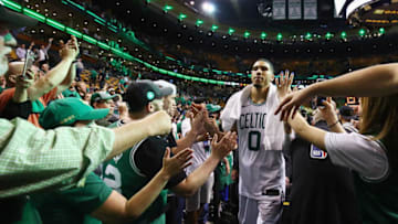 BOSTON, MA - MAY 23: Jayson Tatum #0 of the Boston Celtics high fives fans after defeating the Cleveland Cavaliers 96-83 in Game Five of the 2018 NBA Eastern Conference Finals at TD Garden on May 23, 2018 in Boston, Massachusetts. NOTE TO USER: User expressly acknowledges and agrees that, by downloading and or using this photograph, User is consenting to the terms and conditions of the Getty Images License Agreement. (Photo by Adam Glanzman/Getty Images)