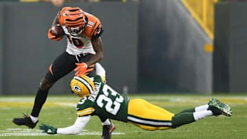 GREEN BAY, WI - SEPTEMBER 24: A.J. Green #18 of the Cincinnati Bengals avoids a tackle by Damarious Randall #23 of the Green Bay Packers during a game at Lambeau Field on September 24, 2017 in Green Bay, Wisconsin. (Photo by Stacy Revere/Getty Images)
