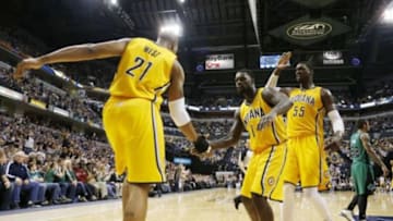 Mar 11, 2014; Indianapolis, IN, USA; Indiana Pacers guard Lance Stephenson (1) congratulates forward David West (21) after he scored against the Boston Celtics at Bankers Life Fieldhouse. Indiana defeats Boston 94-83. Mandatory Credit: Brian Spurlock-USA TODAY Sports