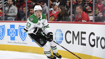 CHICAGO, IL - NOVEMBER 30: Mattias Janmark #13 of the Dallas Stars grabs the puck in the second period against the Chicago Blackhawks at the United Center on November 30, 2017 in Chicago, Illinois. The Dallas Stars defeated the Chicago Blackhawks 4-3. (Photo by Bill Smith/NHLI via Getty Images)