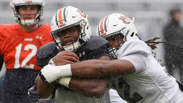 Auburn footballApr 8, 2023; Auburn, AL, USA; Auburn Tigers running back Sean Jackson (44) is tackled by lineman Wilky Denaud (52) during the annual Auburn Spring Game at Jordan-Hare Stadium. Mandatory Credit: John Reed-USA TODAY Sports