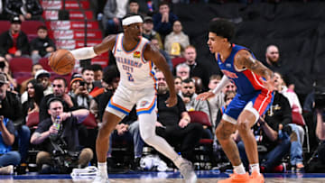 Shai Gilgeous-Alexander #2 of the Oklahoma City Thunder dribbles the ball against Killian Hayes #7 of the Detroit Pistons (Photo by Minas Panagiotakis/Getty Images)