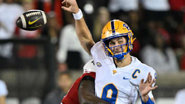 Oct 22, 2022; Louisville, Kentucky, USA; Pittsburgh Panthers quarterback Kedon Slovis (9) fumbles the ball as he is sacked by Louisville Cardinals linebacker Yasir Abdullah (22) during the second half at Cardinal Stadium. Louisville won 24-10. Mandatory Credit: Jamie Rhodes-USA TODAY Sports