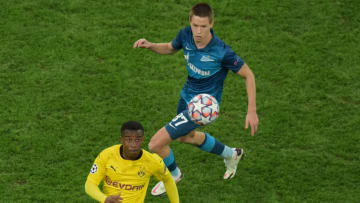 Borussia Dortmund's German forward Youssoufa Moukoko and Zenit St. Petersburg's Russian defender Danila Prokhin vie for the ball during the UEFA Champions League football match between Zenit St. Petersburg and Borussia Dortmund at the Saint Petersburg Stadium (Gazprom Arena) in Saint Petersburg on December 8, 2020. (Photo by Olga MALTSEVA / AFP) (Photo by OLGA MALTSEVA/AFP via Getty Images)