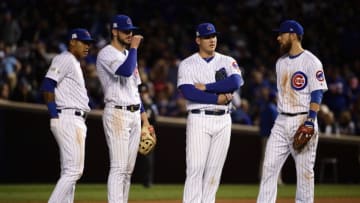 CHICAGO, IL - OCTOBER 17: Addison Russell #27, Kris Bryant #17, Anthony Rizzo #44, and Ben Zobrist #18 of the Chicago Cubs meet during a pitching change in the sixth inning against the Los Angeles Dodgers during game three of the National League Championship Series at Wrigley Field on October 17, 2017 in Chicago, Illinois. (Photo by Jonathan Daniel/Getty Images)