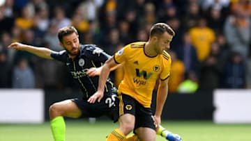 WOLVERHAMPTON, ENGLAND - AUGUST 25: Diogo Jota of Wolverhampton Wanderers and Bernardo Silva of Manchester City battle for the ball during the Premier League match between Wolverhampton Wanderers and Manchester City at Molineux on August 25, 2018 in Wolverhampton, United Kingdom. (Photo by Shaun Botterill/Getty Images)