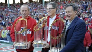Nov 2, 2013; Boston, MA, USA; Boston Red Sox executives (left to right) Larry Lucchino , John Henry and Tom Werner hold World Series trophies inside of Fenway Park prior to the World Series parade and celebration. Mandatory Credit: Bob DeChiara-USA TODAY Sports