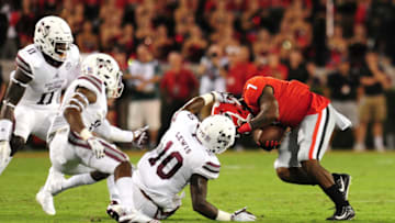 ATHENS, GA - SEPTEMBER 23: D'Andre Swift #7 of the Georgia Bulldogs is tackled by Leo Lewis #10 of the Mississippi State Bulldogs at Sanford Stadium on September 23, 2017 in Athens, Georgia. (Photo by Scott Cunningham/Getty Images)