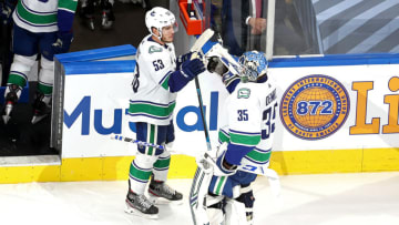 EDMONTON, ALBERTA - SEPTEMBER 01: Thatcher Demko #35 of the Vancouver Canucks is congratulated by Bo Horvat #53 after their 2-1 victory against the Vegas Golden Knights in Game Five of the Western Conference Second Round during the 2020 NHL Stanley Cup Playoffs at Rogers Place on September 01, 2020 in Edmonton, Alberta, Canada. (Photo by Bruce Bennett/Getty Images)