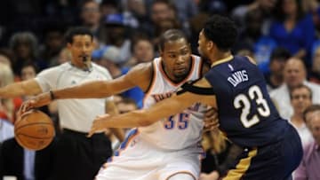 Feb 6, 2015; Oklahoma City, OK, USA; Oklahoma City Thunder forward Kevin Durant (35) handles the ball against New Orleans Pelicans forward Anthony Davis (23) during the third quarter at Chesapeake Energy Arena. Mandatory Credit: Mark D. Smith-USA TODAY Sports