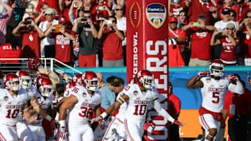 Dec 31, 2015; Miami Gardens, FL, USA; The Oklahoma Sooners run onto the field prior to the 2015 CFP semifinal at the Orange Bowl against the Clemson Tigers at Sun Life Stadium. Mandatory Credit: Steve Mitchell-USA TODAY Sports