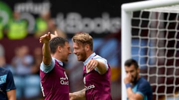 BIRMINGHAM, ENGLAND - JULY 30: Nathan Baker (r) celebrates with Tommy Elphick of Villa after scoring the opening goal during the pre- season friendly between Aston Villa and Middlesbrough at Villa Park on July 30, 2016 in Birmingham, England. (Photo by Stu Forster/Getty Images)