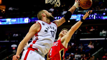 Mar 26, 2016; New Orleans, LA, USA; Toronto Raptors center Jonas Valanciunas (17) and New Orleans Pelicans forward Luke Babbitt (8) battle for a rebound during the second half of a game at the Smoothie King Center. The Raptors defeated the Pelicans 115-91. Mandatory Credit: Derick E. Hingle-USA TODAY Sports