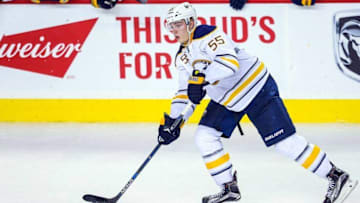 Dec 10, 2015; Calgary, Alberta, CAN; Buffalo Sabres defenseman Rasmus Ristolainen (55) controls the puck against the Calgary Flames during the third period at Scotiabank Saddledome. Calgary Flames won 4-3. Mandatory Credit: Sergei Belski-USA TODAY Sports