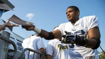 Jul 29, 2014; St. Louis, MO, USA; St. Louis Rams defensive lineman Michael Sam (96) signs autographs after practice at Rams Park. Mandatory Credit: Scott Rovak-USA TODAY Sports