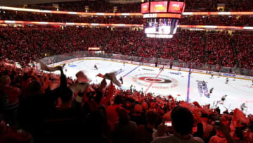 RALEIGH, NORTH CAROLINA - MAY 16: Carolina Hurricanes fans cheer prior to Game Four between the Boston Bruins and the Carolina Hurricanes in the Eastern Conference Finals during the 2019 NHL Stanley Cup Playoffs at PNC Arena on May 16, 2019 in Raleigh, North Carolina. (Photo by Grant Halverson/Getty Images)