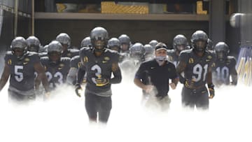 Sep 26, 2020; Pittsburgh, Pennsylvania, USA; Pittsburgh Panthers defensive lineman Deslin Alexandre (5) and defensive back Damar Hamlin (3) and head coach Pat Narduzzi and defensive lineman Patrick Jones II (91) lead the team onto the field to play the Louisville Cardinals at Heinz Field. Pittsburgh won 23-20. Mandatory Credit: Charles LeClaire-USA TODAY Sports