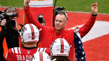 RALEIGH, NC - DECEMBER 01: Head coach Dave Doeren of the North Carolina State Wolfpack pumps up the fans prior to their game against the East Carolina Pirates at Carter-Finley Stadium on December 1, 2018 in Raleigh, North Carolina. (Photo by Lance King/Getty Images)